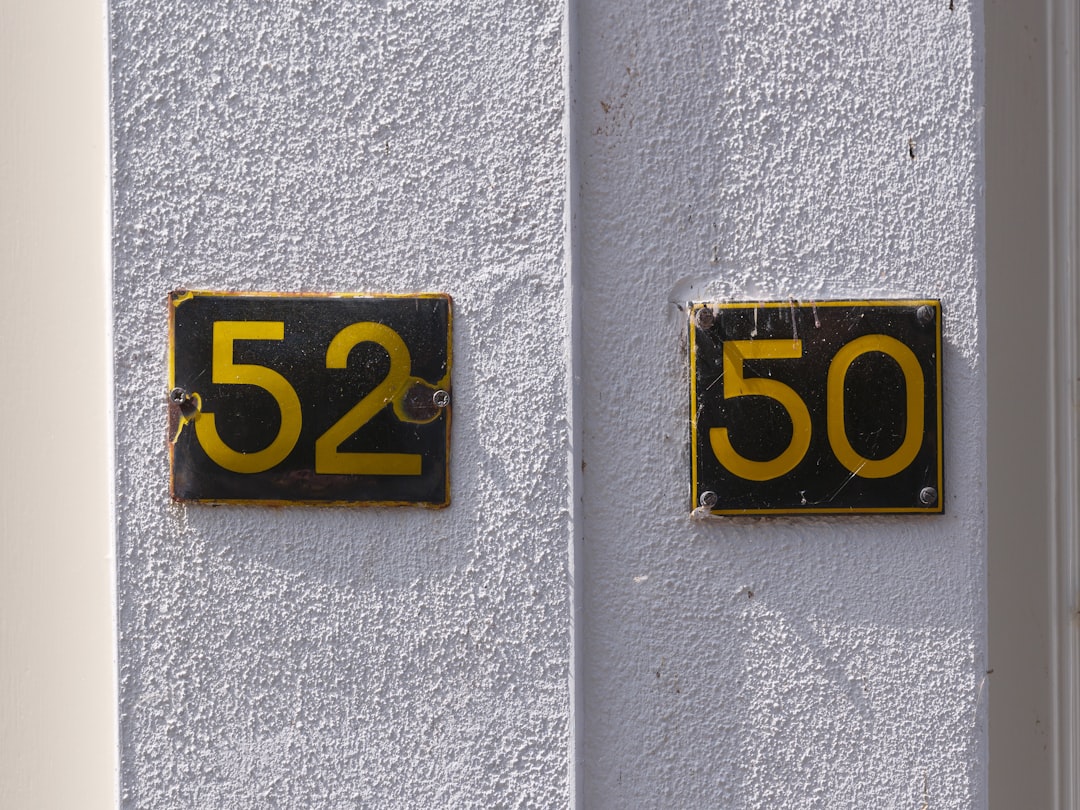 House numbers 52 and 50 are shown.